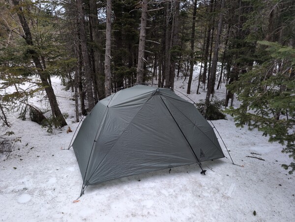 Tent set up on the snow at Elk Pass