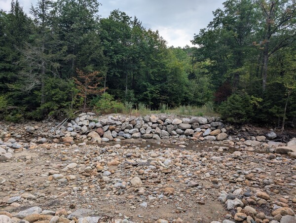 This rock foundation is all that remains of the former bridge
