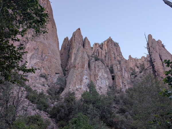 Rock formations tower above the West Fork trail